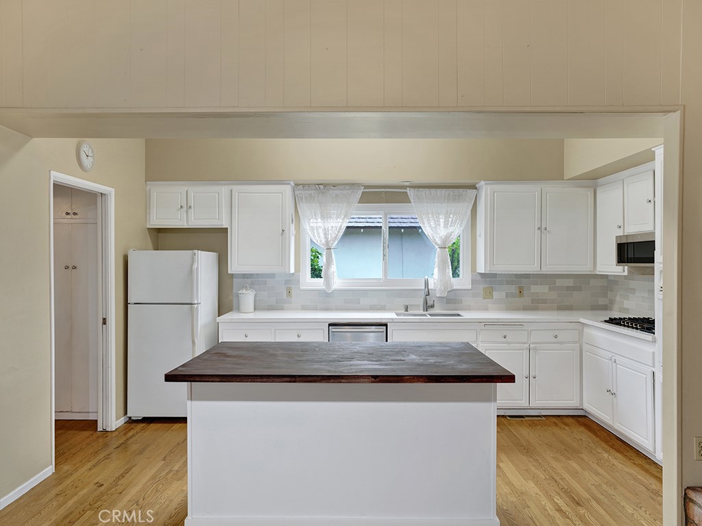 1019 Dorothy Lane Fullerton, CA 92831 - Photo 17 of 41 a kitchen with granite countertop a sink cabinets and wooden floor