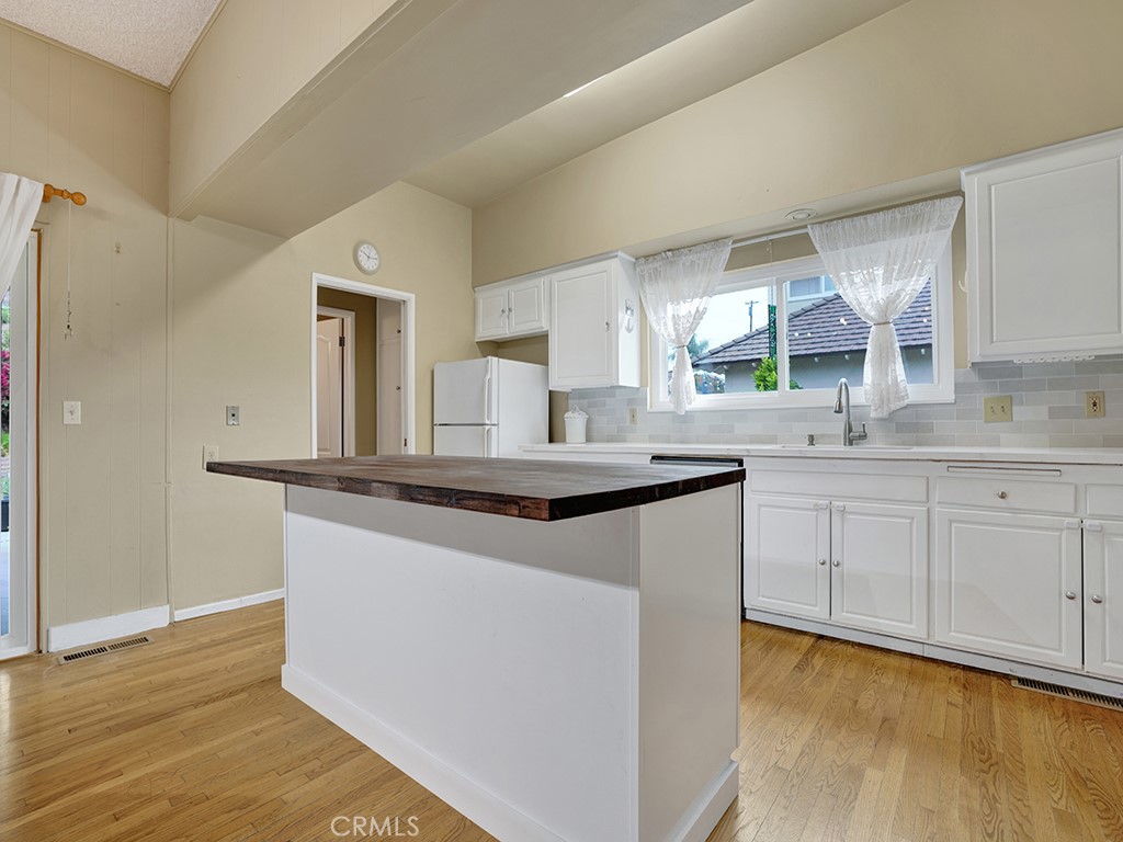 1019 Dorothy Lane Fullerton, CA 92831 - Photo 19 of 41 a kitchen with granite countertop a sink cabinets and wooden floor