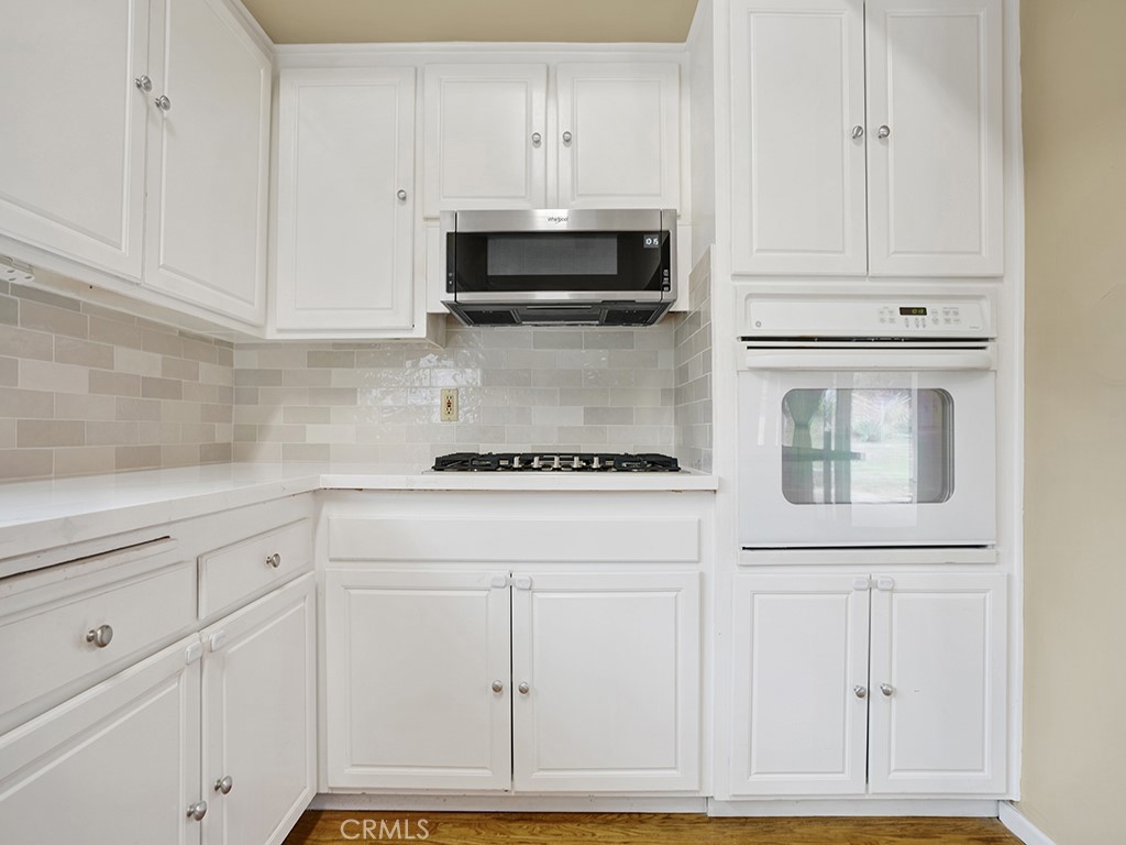 1019 Dorothy Lane Fullerton, CA 92831 - Photo 21 of 41 a kitchen with white cabinets and appliances