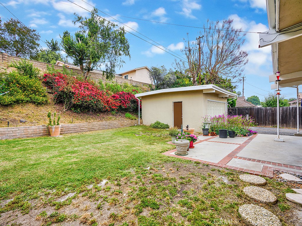 1019 Dorothy Lane Fullerton, CA 92831 - Photo 40 of 41 a backyard of a house with wooden fence and flowers