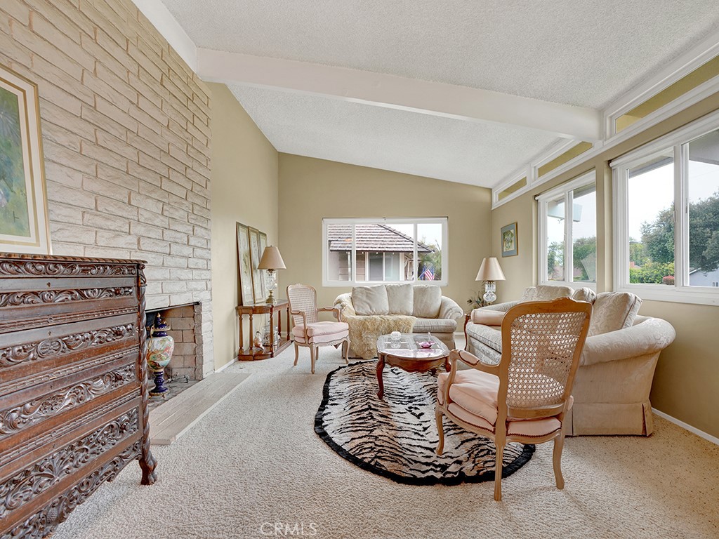 1019 Dorothy Lane Fullerton, CA 92831 - Photo 8 of 41 a living room with furniture a fireplace and a large window