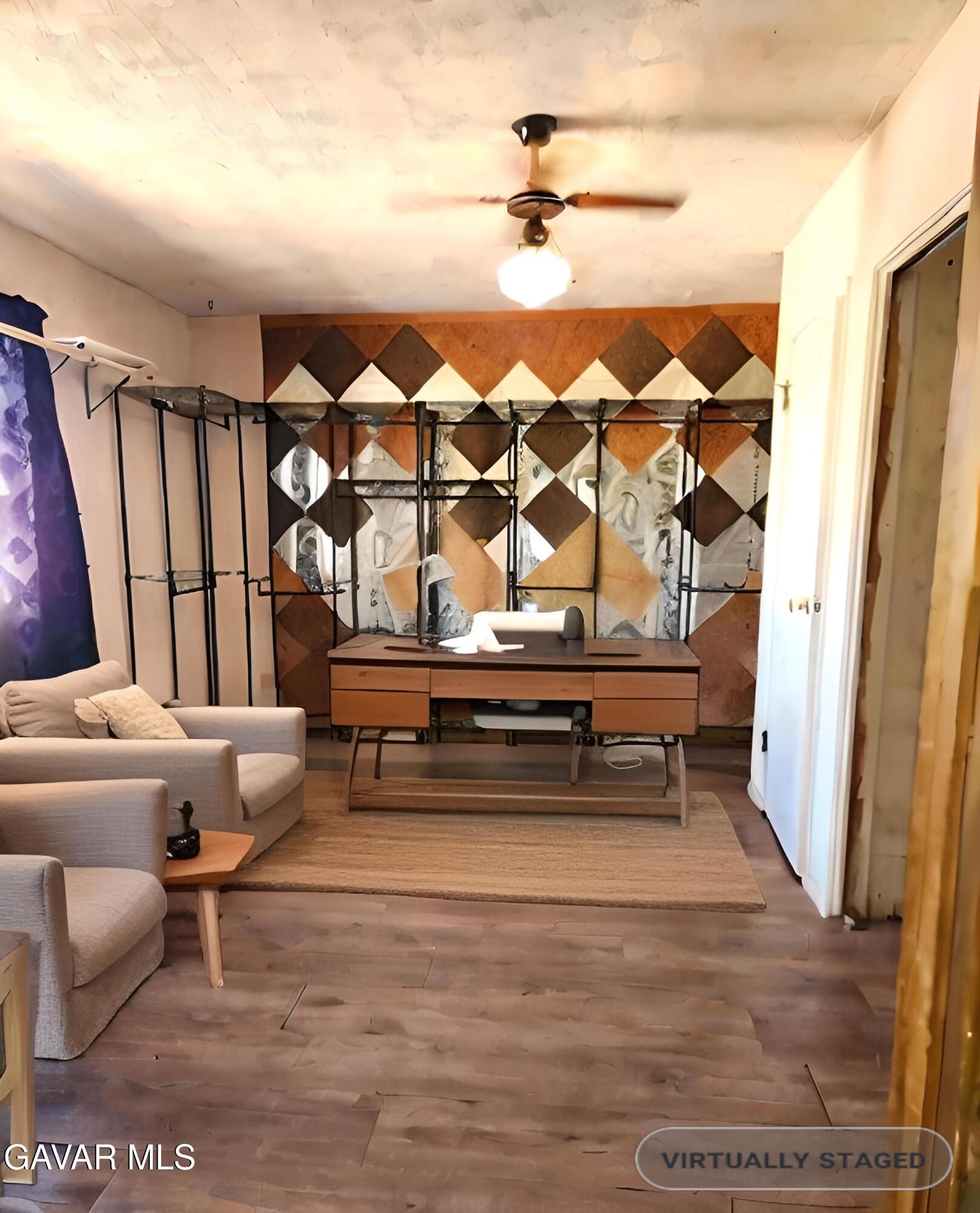 1407 West Burns Avenue Ridgecrest, CA 93555 - Photo 11 of 25 a living room with furniture and a rug