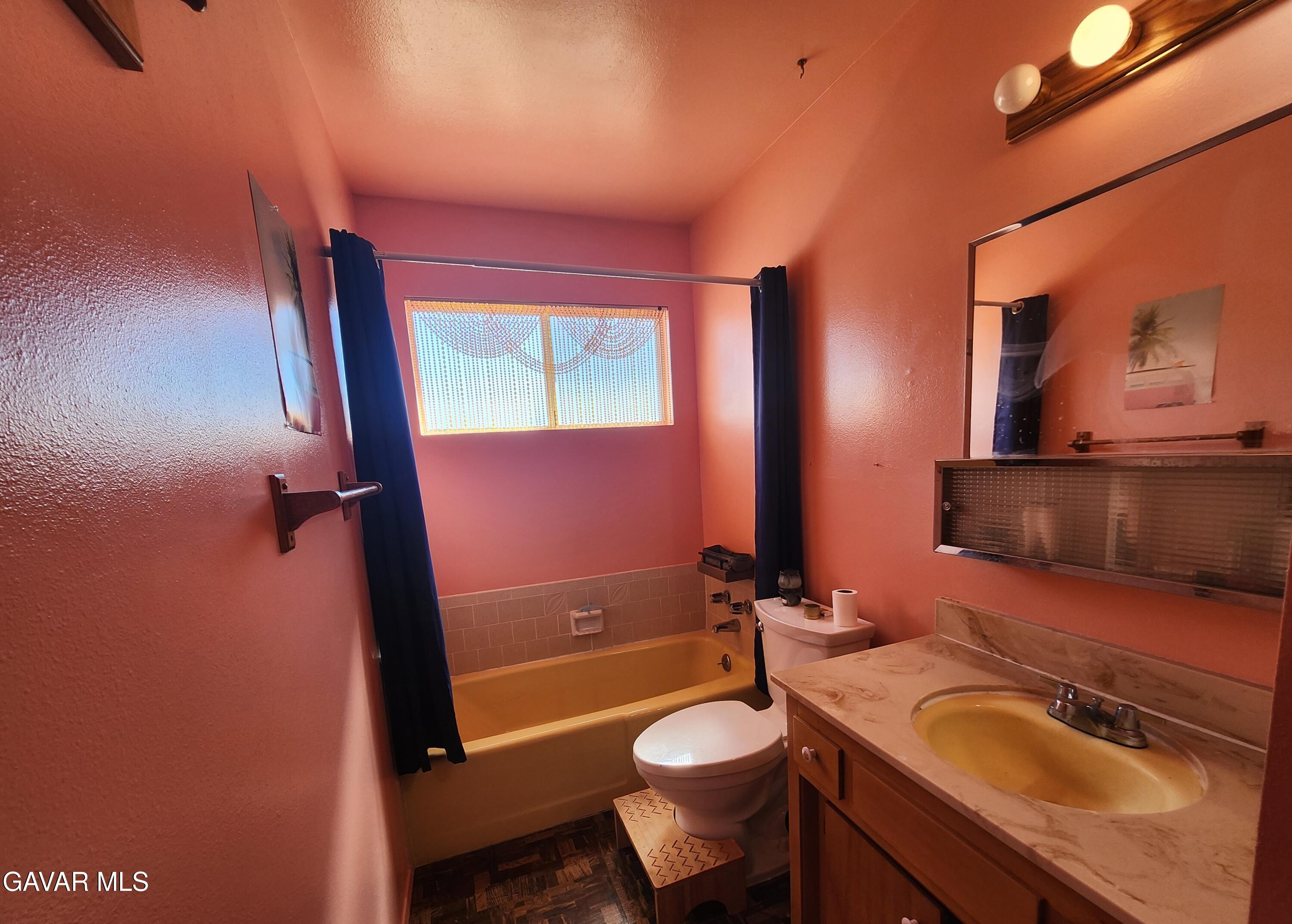 1407 West Burns Avenue Ridgecrest, CA 93555 - Photo 17 of 25 a bathroom with a sink a toilet and tub