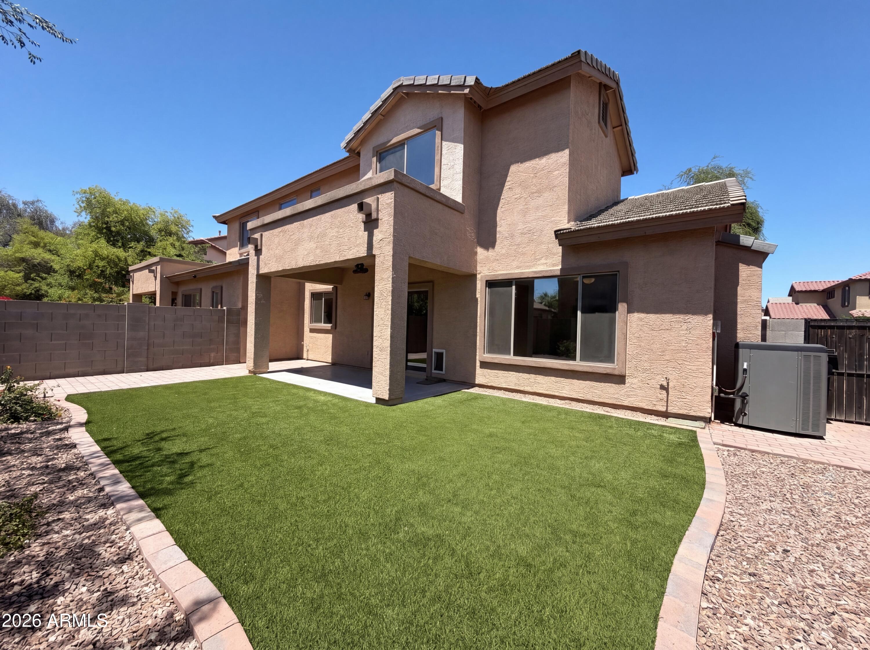 1565 East Hopkins Road Gilbert, AZ 85295 - Photo 5 of 29 a front view of a house with a yard