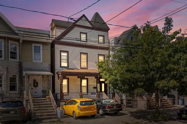 a car parked in front of a house