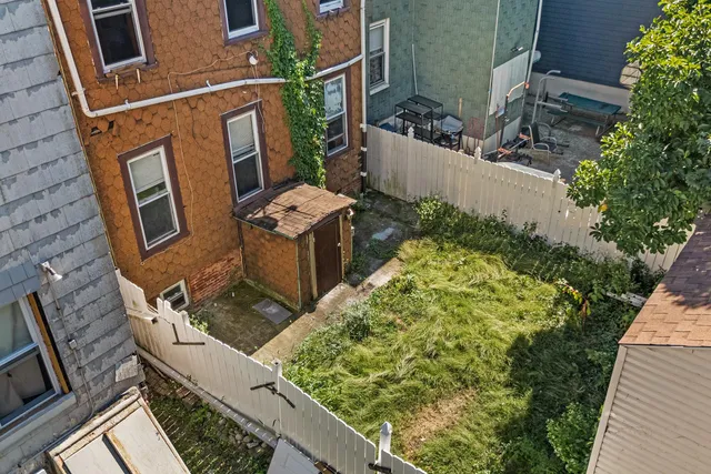 a backyard of a house with lots of green space