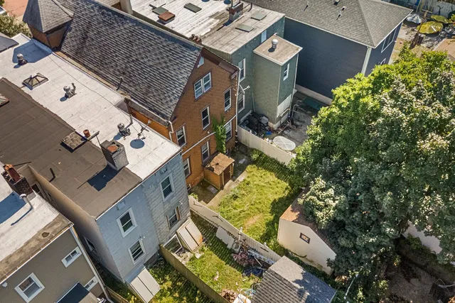 an aerial view of a house with a garden