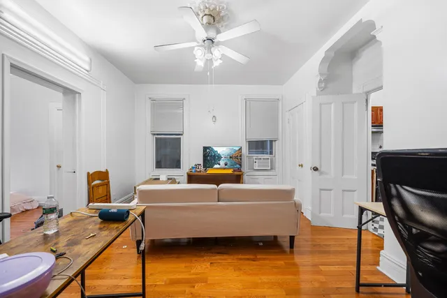 a bedroom with a bed and a workspace