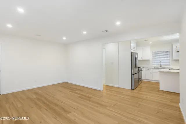 a view of kitchen with wooden floor