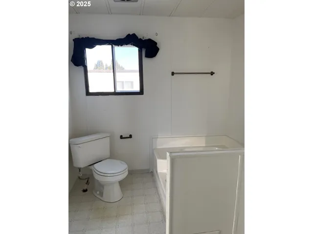 a view of a porch with a floor to ceiling window