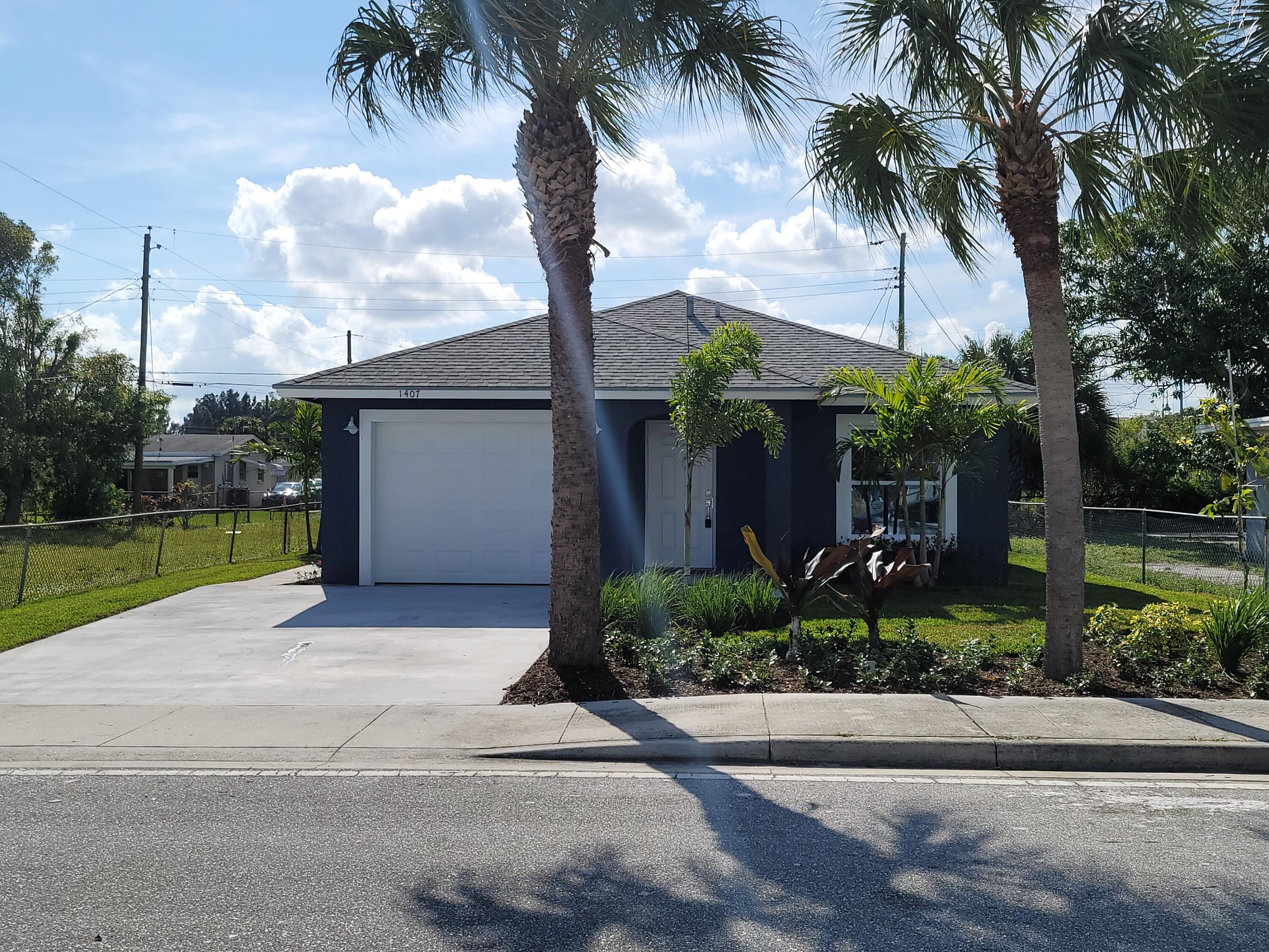 1407 West 32nd Street Riviera Beach, FL 33404 - Photo 1 of 21 20211211_112022