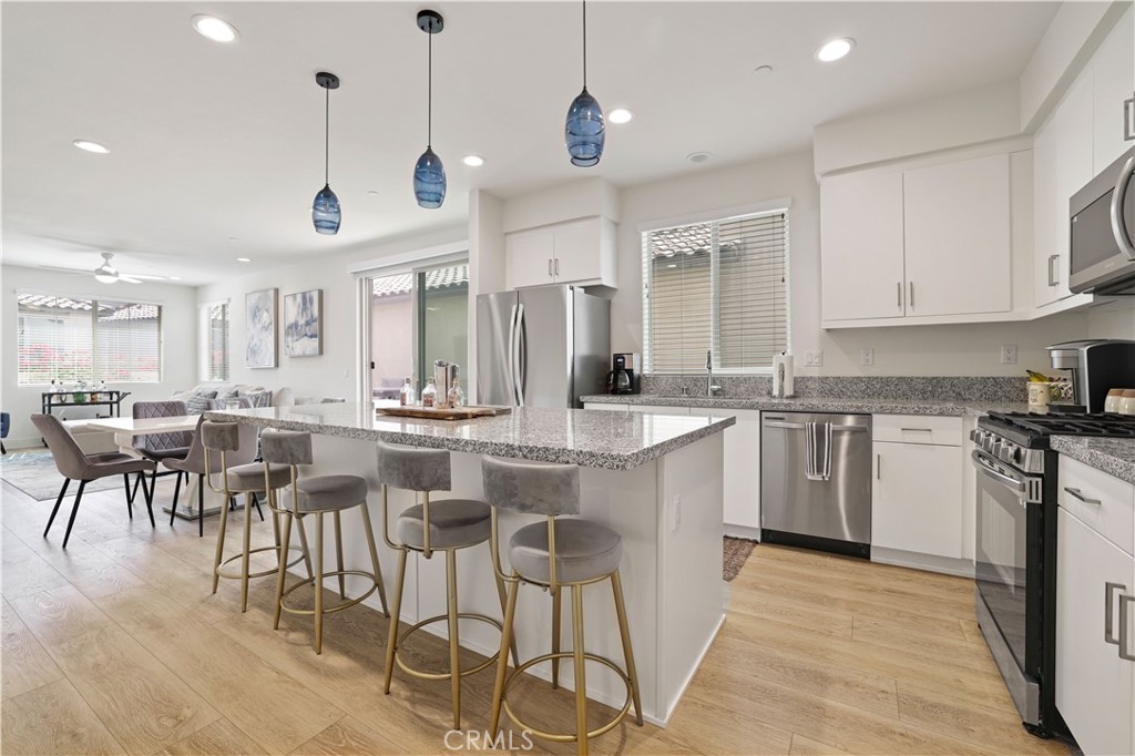 80138 Whisper Rock Way La Quinta, CA 92253 - Photo 12 of 29 a kitchen with lots of counter space and appliances