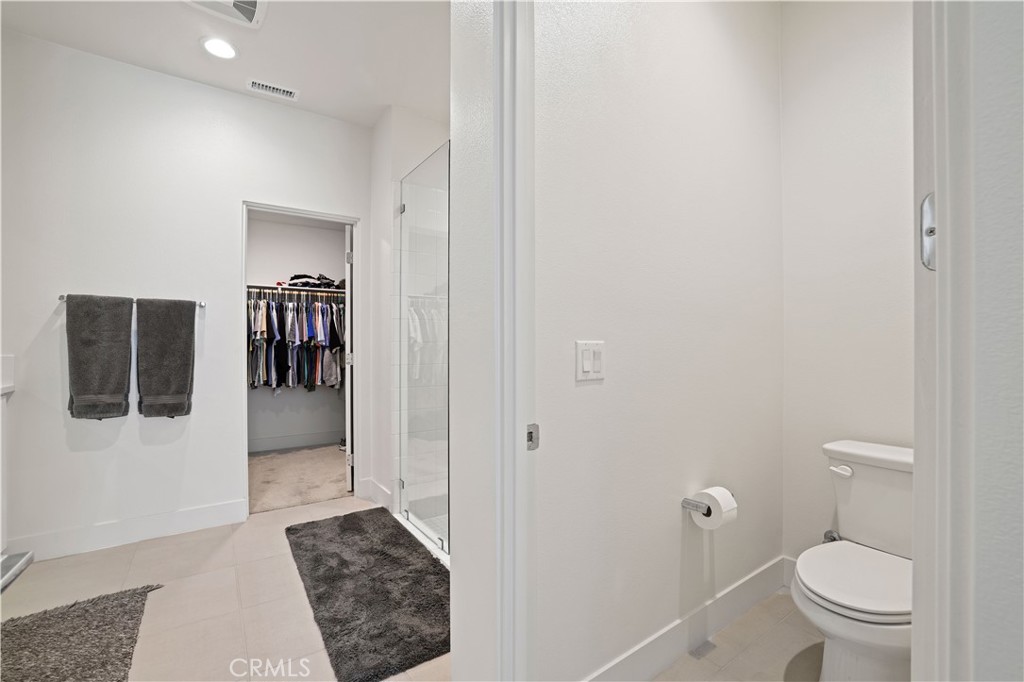 80138 Whisper Rock Way La Quinta, CA 92253 - Photo 15 of 29 a bathroom with a toilet and a shower