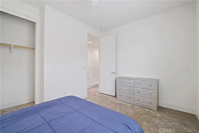 a view of room with cabinet and mirror