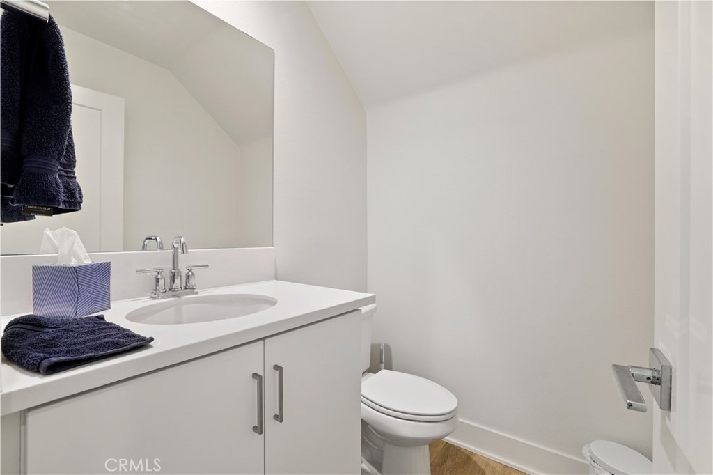 80138 Whisper Rock Way La Quinta, CA 92253 - Photo 29 of 29 a bathroom with a sink a toilet a mirror and vanity