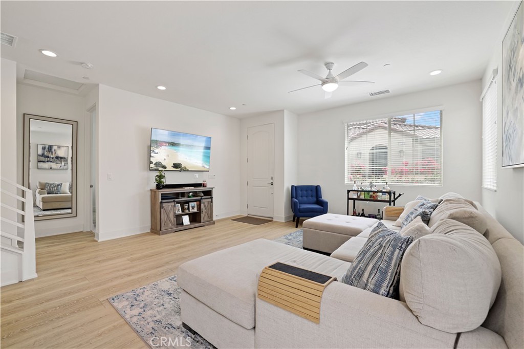 80138 Whisper Rock Way La Quinta, CA 92253 - Photo 8 of 29 a living room with furniture and a flat screen tv