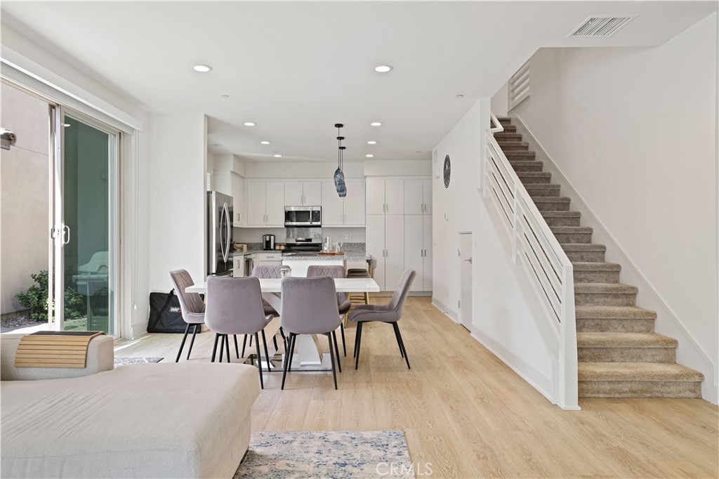 80138 Whisper Rock Way La Quinta, CA 92253 - Photo 9 of 29 a dining room with furniture entryway and wooden floor