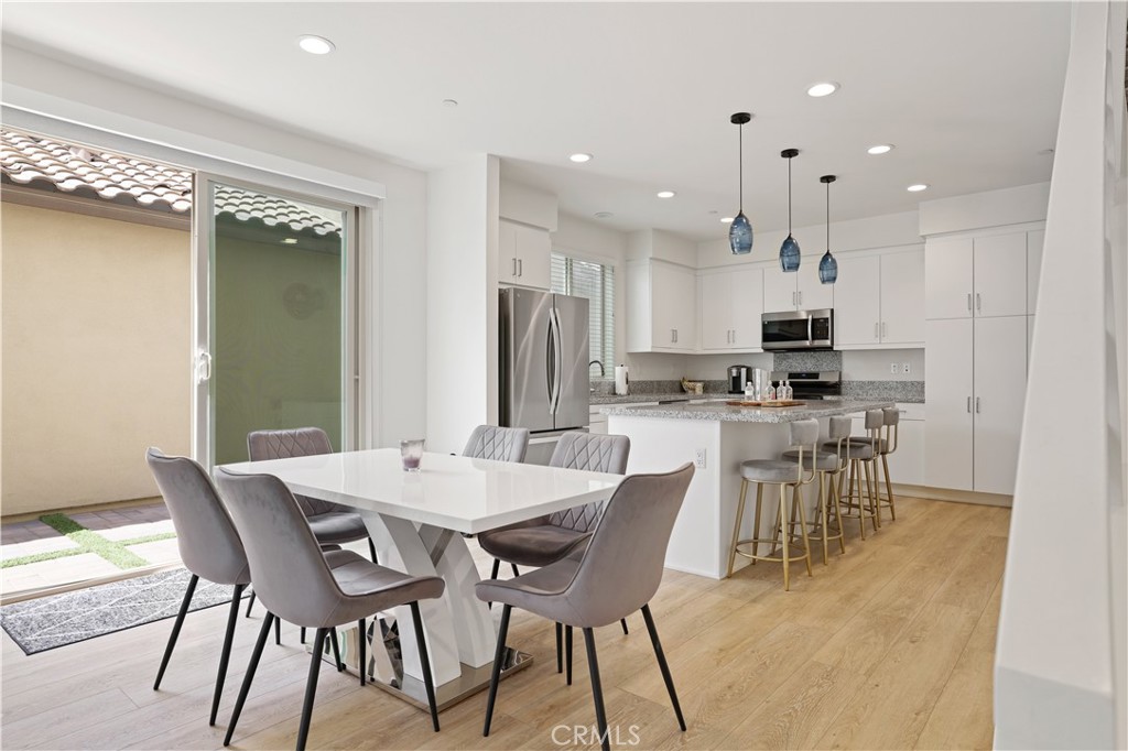 80138 Whisper Rock Way La Quinta, CA 92253 - Photo 10 of 29 a view of a dining room with furniture and wooden floor