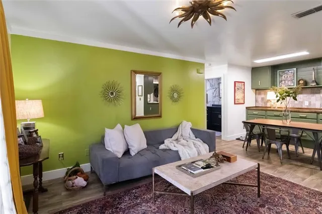 a living room with furniture and a rug