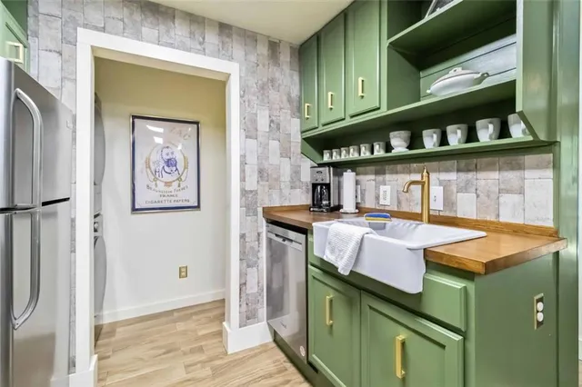 a kitchen with a sink and a refrigerator