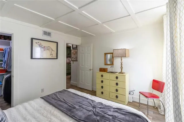 a bedroom with a bed and furniture