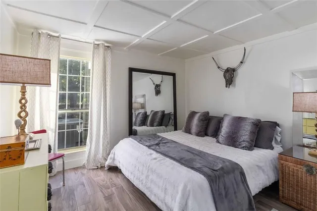 a bedroom with a bed and a window