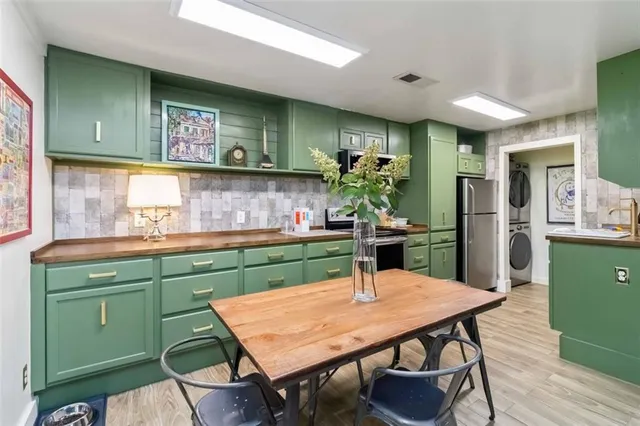 a kitchen with a table and chairs in it
