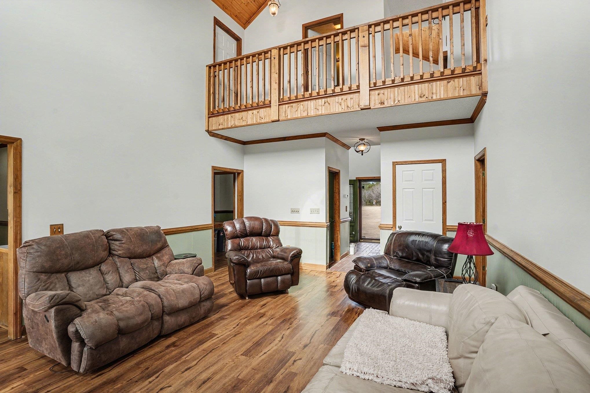 202 Highway 747 Loris Sc 29569 Loris, SC 29569 - Photo 5 of 34 Living area featuring high vaulted ceiling, wood finished floors, and wooden ceiling