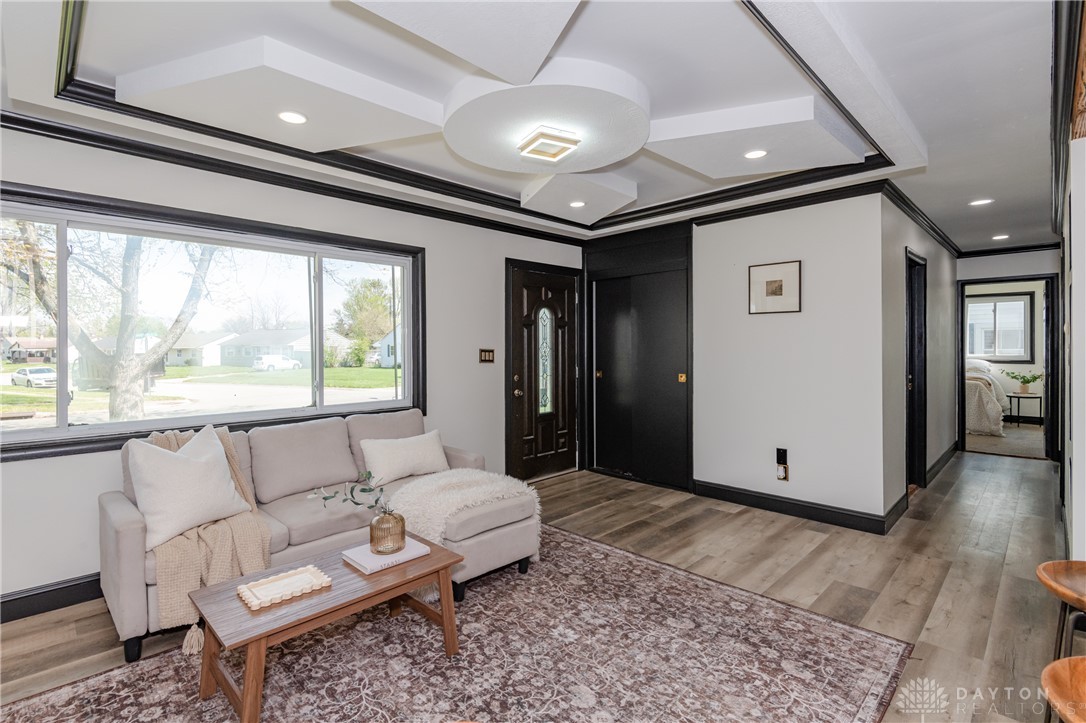 5240 Haverfield Road Dayton, OH 45432 - Photo 10 of 58 This living area features a modern ceiling design and ample natural light, creating a bright and inviting atmosphere.