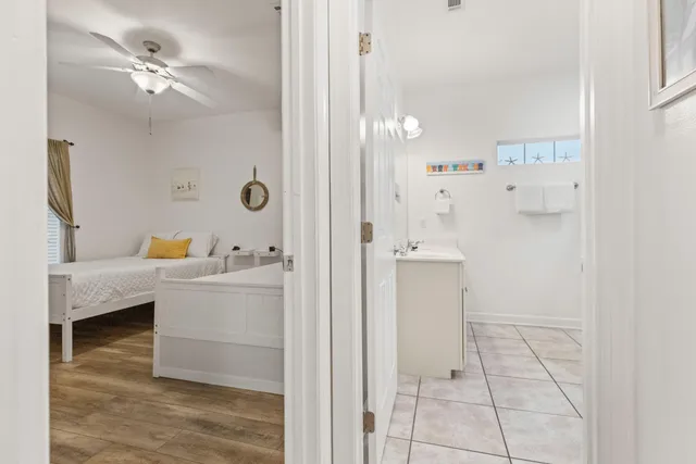 a bathroom with a bathtub a sink and a mirror