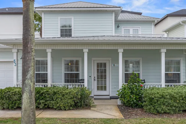 front view of a brick house with a large windows