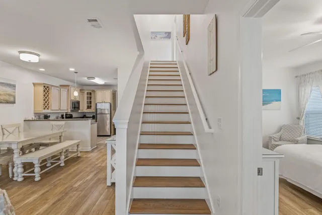 a view of entryway and hall with wooden floor