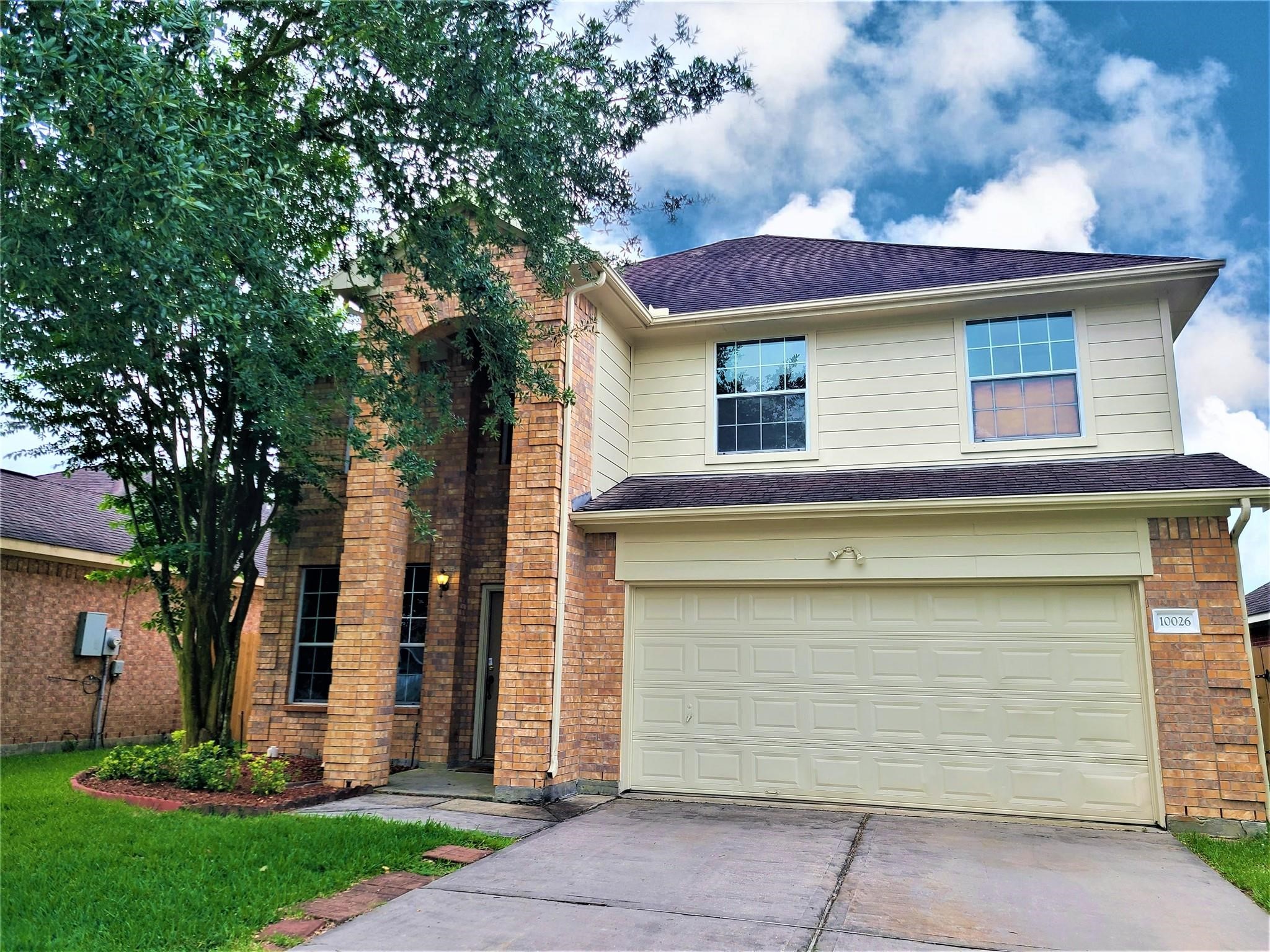 10026 Gil Jr Lane Houston, TX 77075 - Photo 1 of 14 a view of a house with a yard
