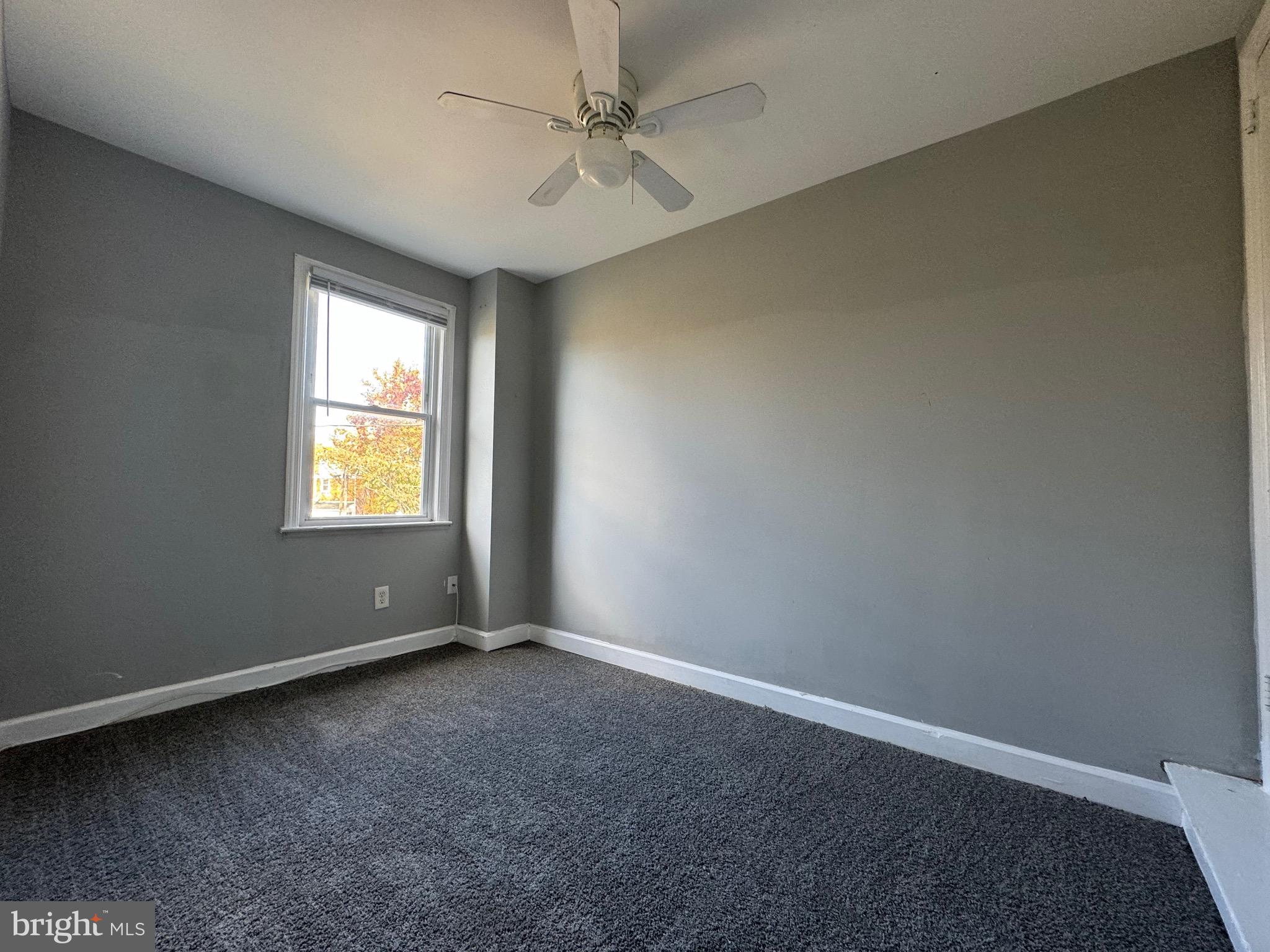 320 Sollers Point Road Dundalk, MD 21222 - Photo 14 of 16 an empty room with windows and fan