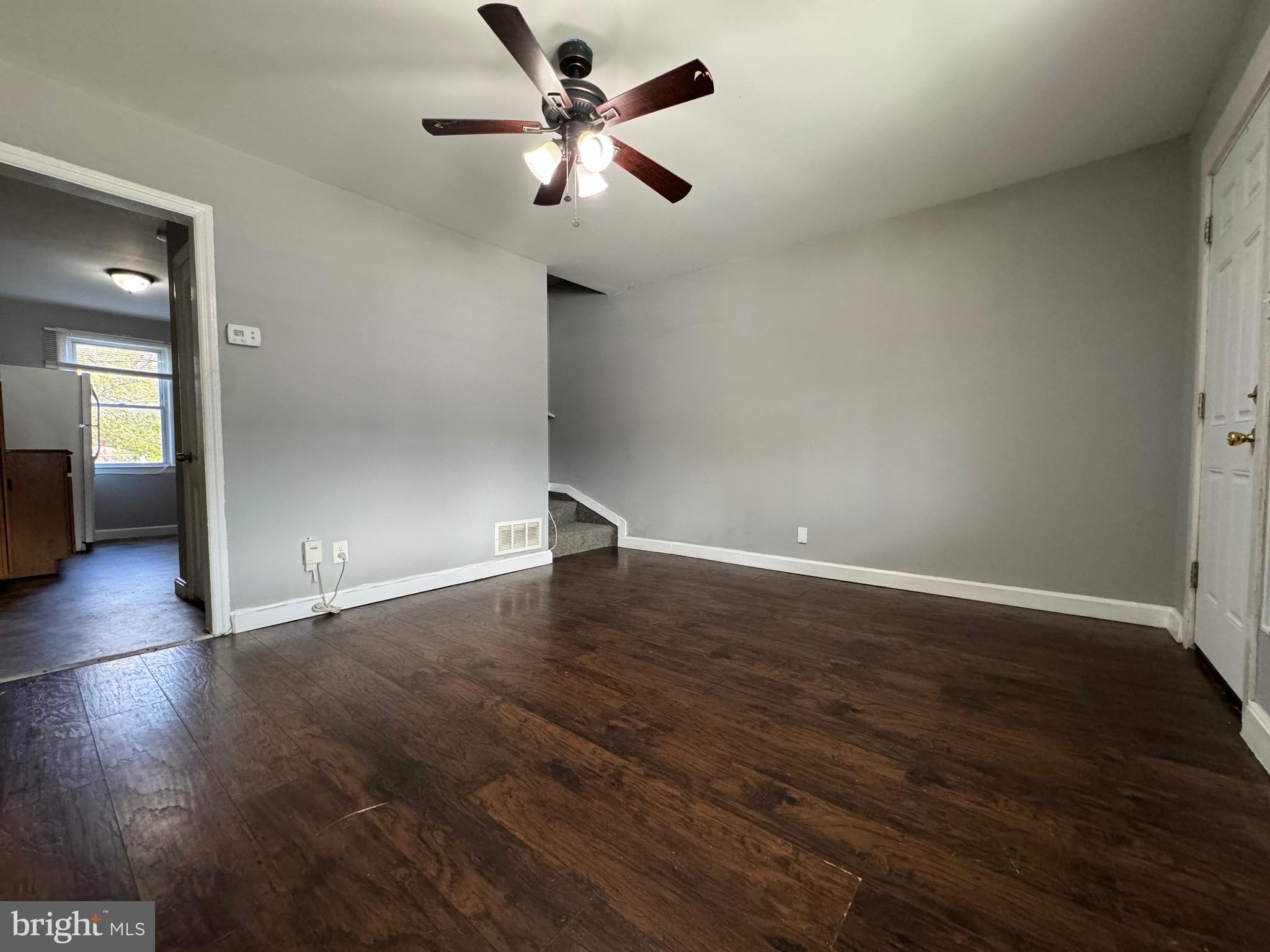 320 Sollers Point Road Dundalk, MD 21222 - Photo 5 of 16 an empty room with wooden floor and windows