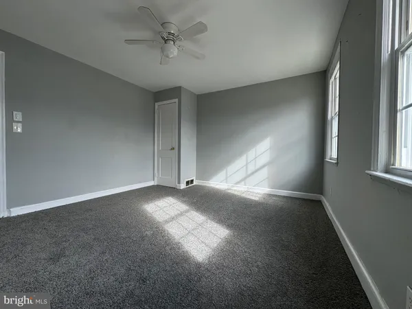 a view of empty room with windows