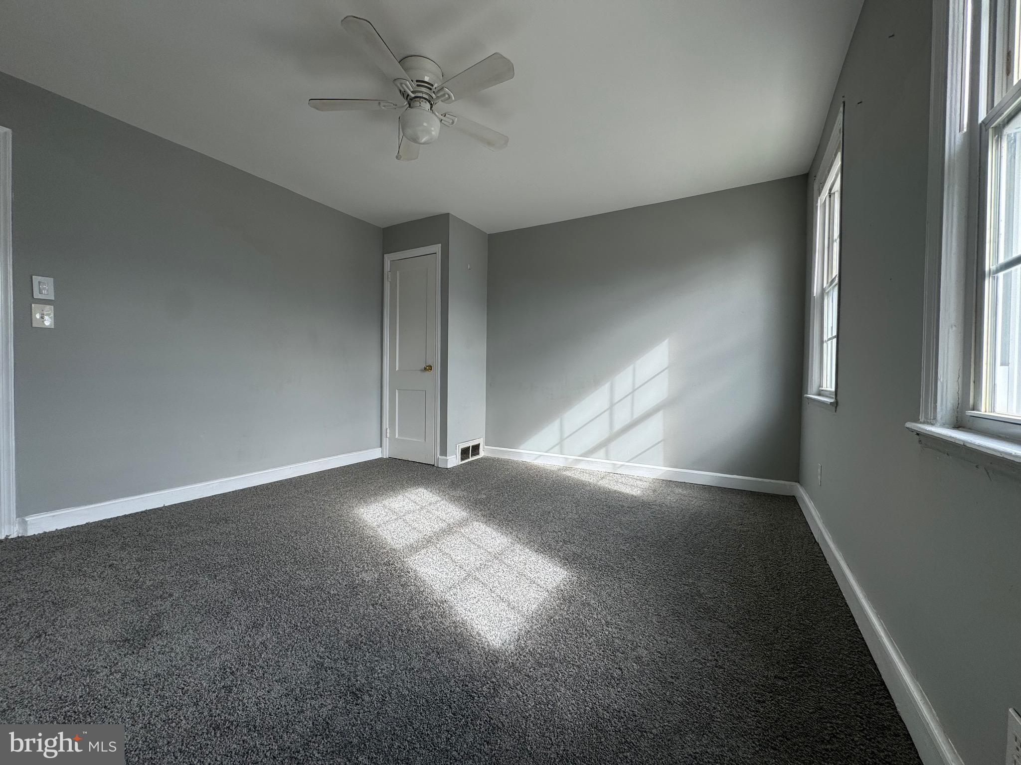 320 Sollers Point Road Dundalk, MD 21222 - Photo 10 of 16 a view of empty room with windows