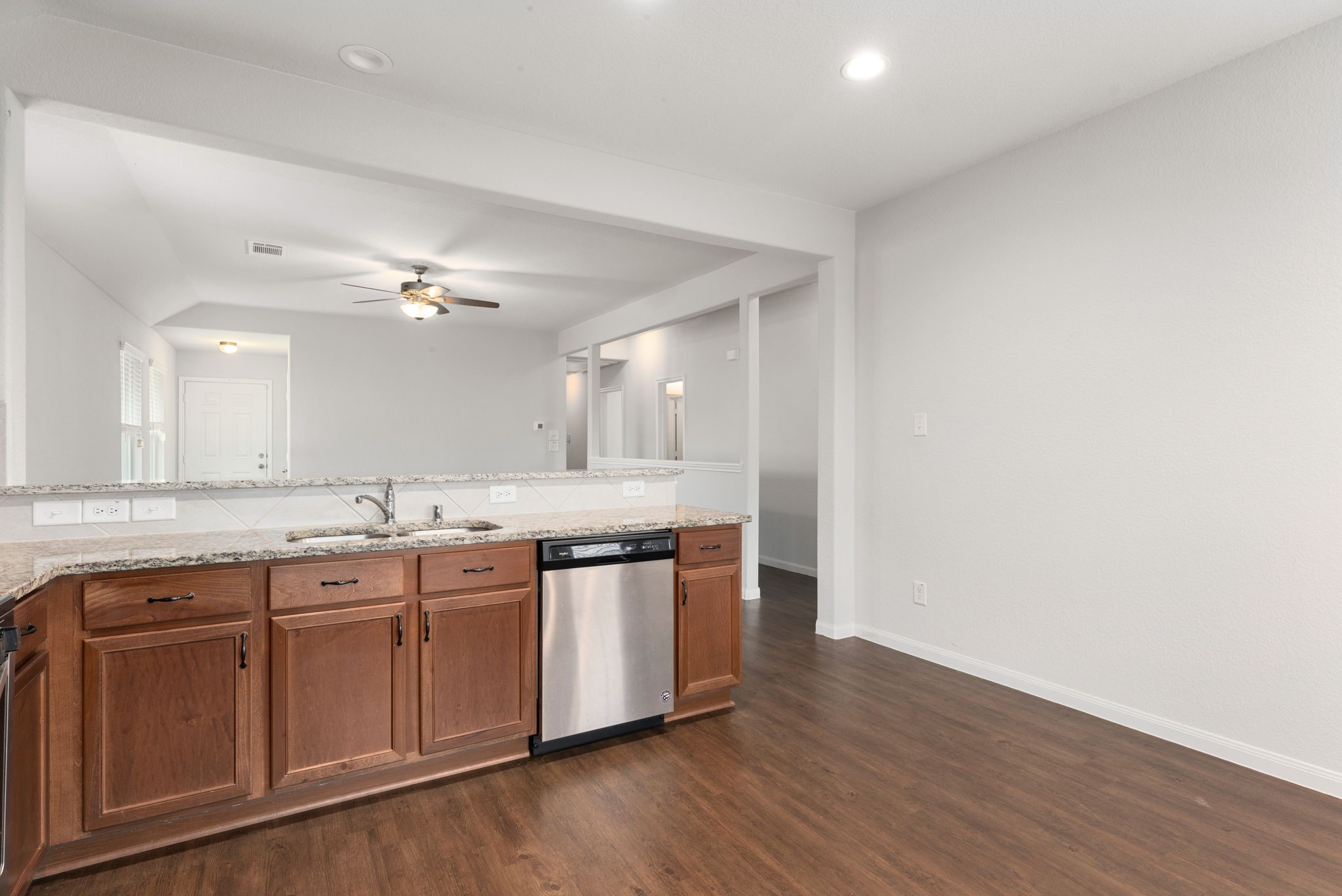 17555 Greystanes Road Humble, TX 77346 - Photo 6 of 28 a spacious bathroom with a granite countertop sink and a mirror
