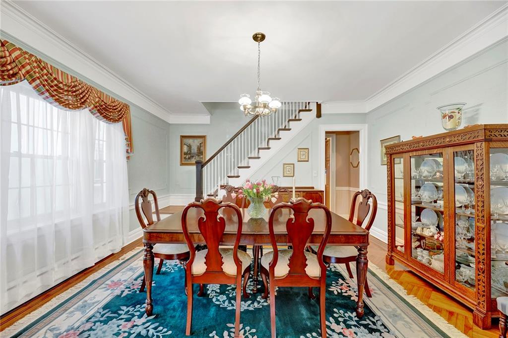 7607 Colonial Road Brooklyn, NY 11209 - Photo 12 of 35 a dining room with furniture and wooden floor