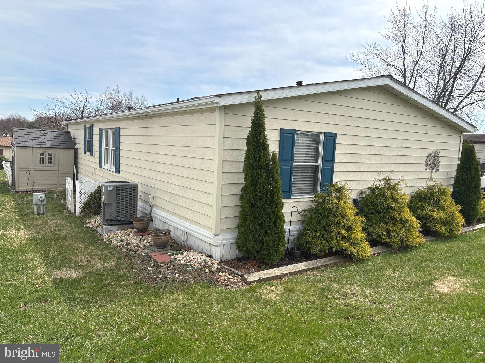 Rear of home with shed