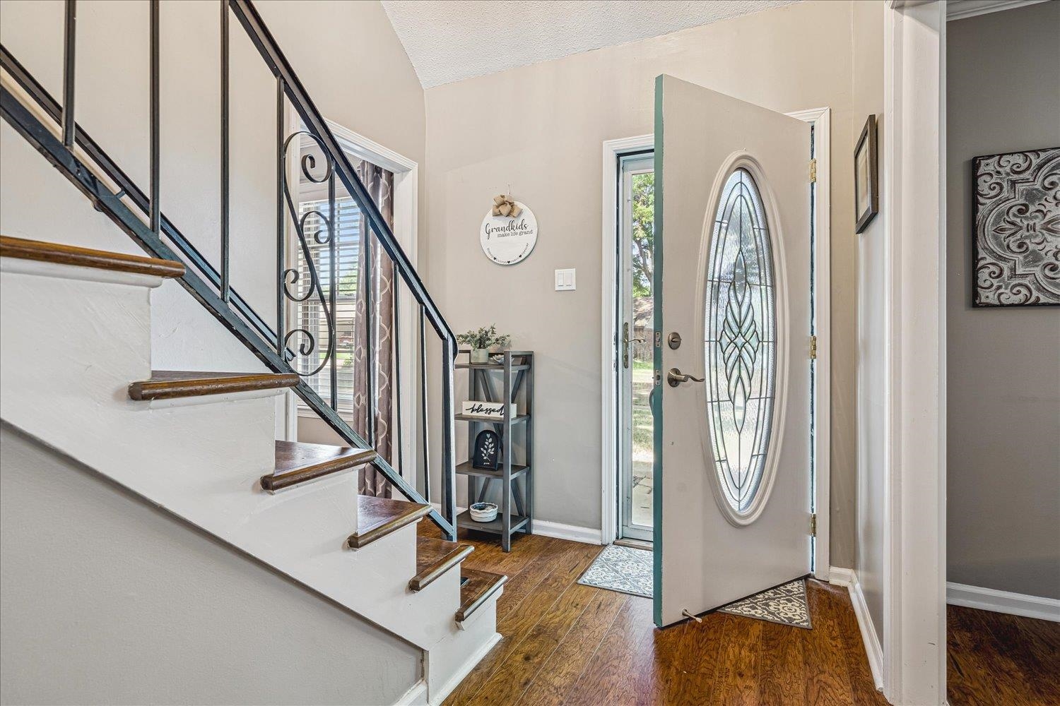 2944 Charles Bryan Road Bartlett, TN 38134 - Photo 3 of 36 a view of a hallway with wooden floor and staircase