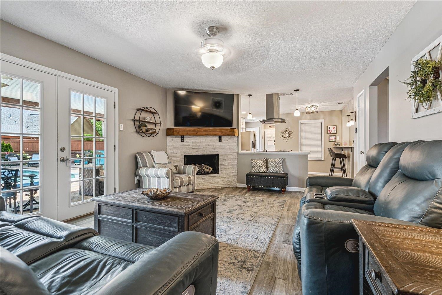 2944 Charles Bryan Road Bartlett, TN 38134 - Photo 6 of 36 a living room with furniture a fireplace and a flat screen tv