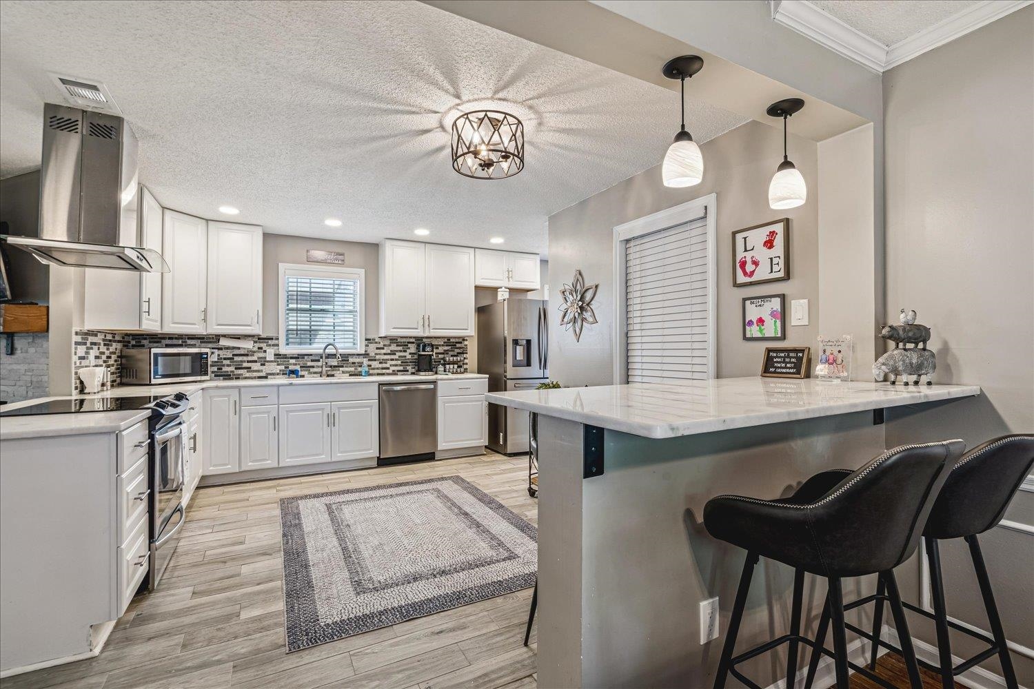 2944 Charles Bryan Road Bartlett, TN 38134 - Photo 8 of 36 a kitchen with a sink cabinets and window
