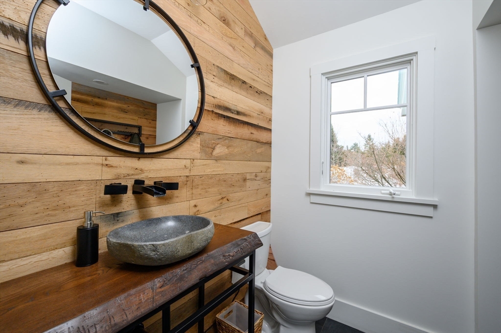 9 Tillinghast Drive Hingham, MA 02043 - Photo 17 of 39 a bathroom with a toilet a sink and a mirror