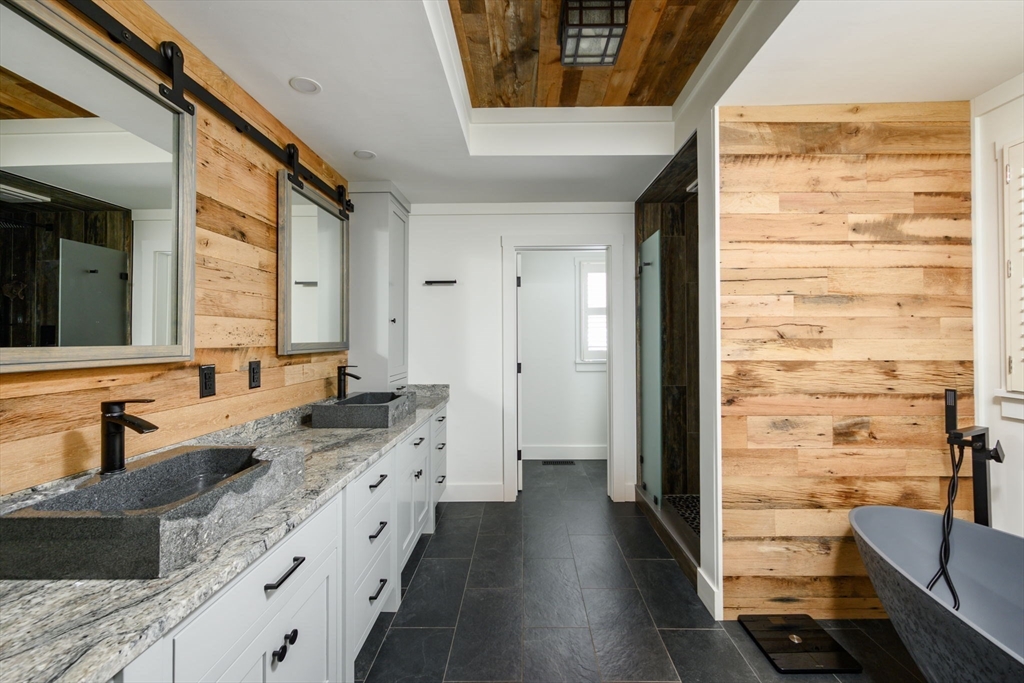 9 Tillinghast Drive Hingham, MA 02043 - Photo 21 of 39 a bathroom with a granite countertop sink a mirror and a shower