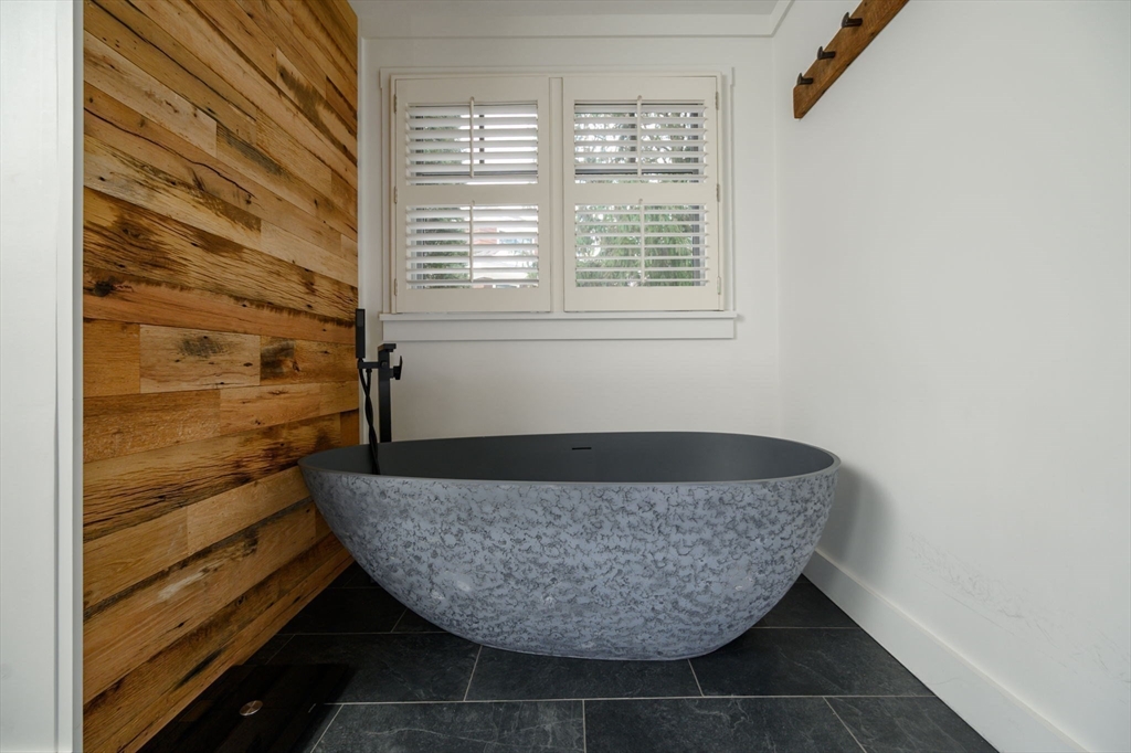 9 Tillinghast Drive Hingham, MA 02043 - Photo 22 of 39 a room with a wooden floor and a sink