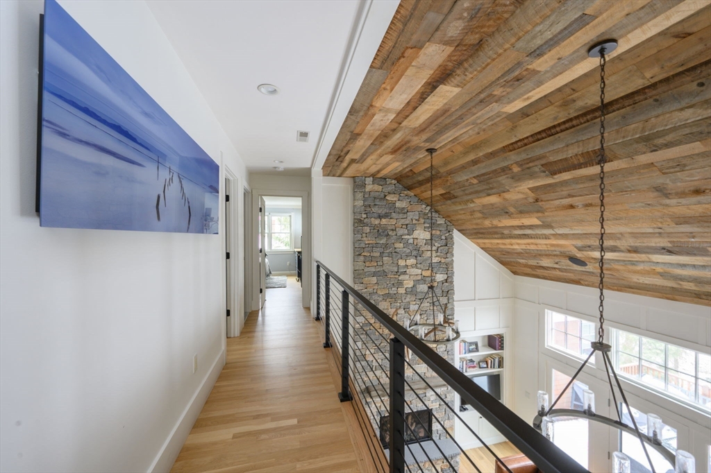 9 Tillinghast Drive Hingham, MA 02043 - Photo 25 of 39 a view of a hallway with wooden floor and staircase