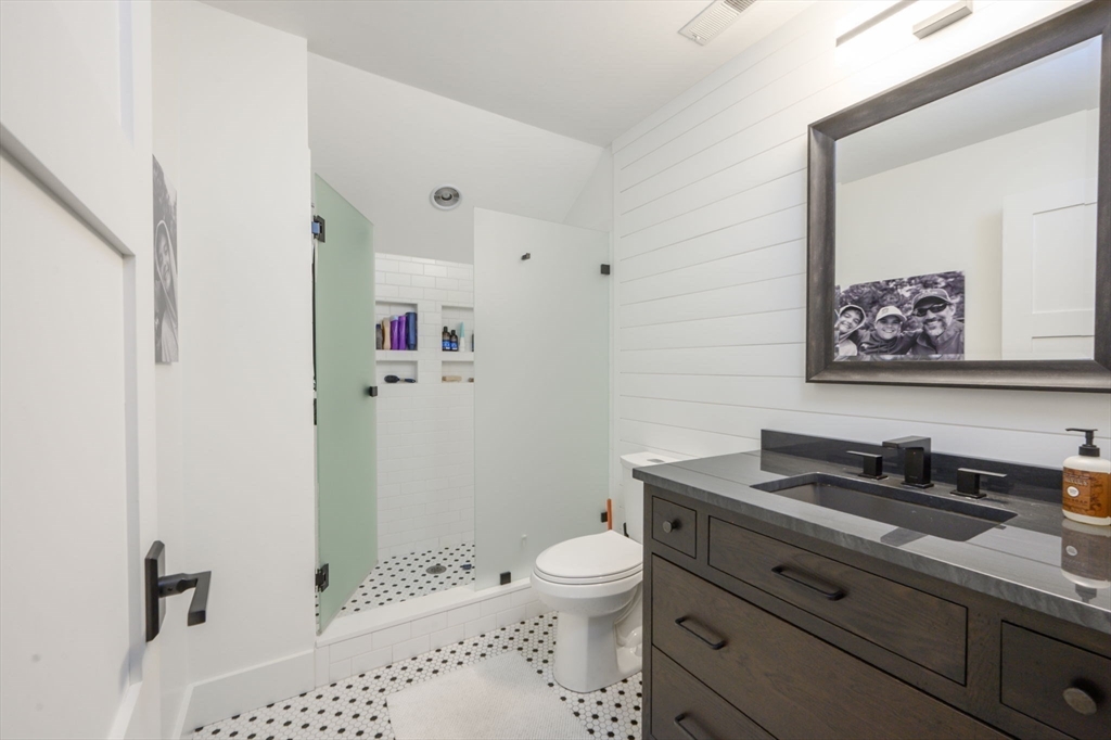 9 Tillinghast Drive Hingham, MA 02043 - Photo 27 of 39 a bathroom with a sink a toilet and shower