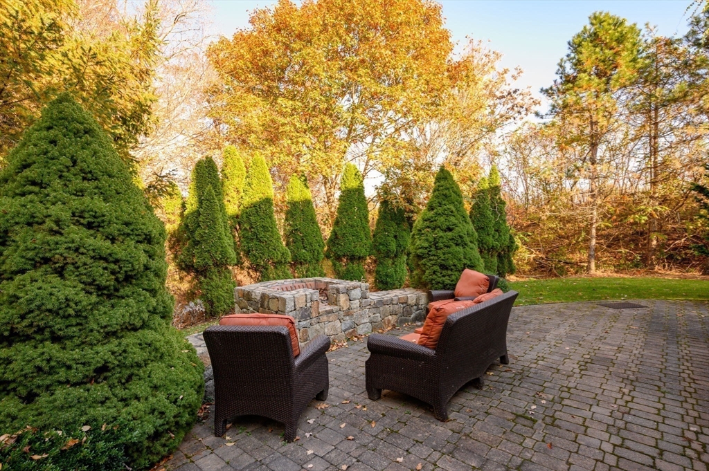 9 Tillinghast Drive Hingham, MA 02043 - Photo 34 of 39 a view of a couches in a backyard with large trees