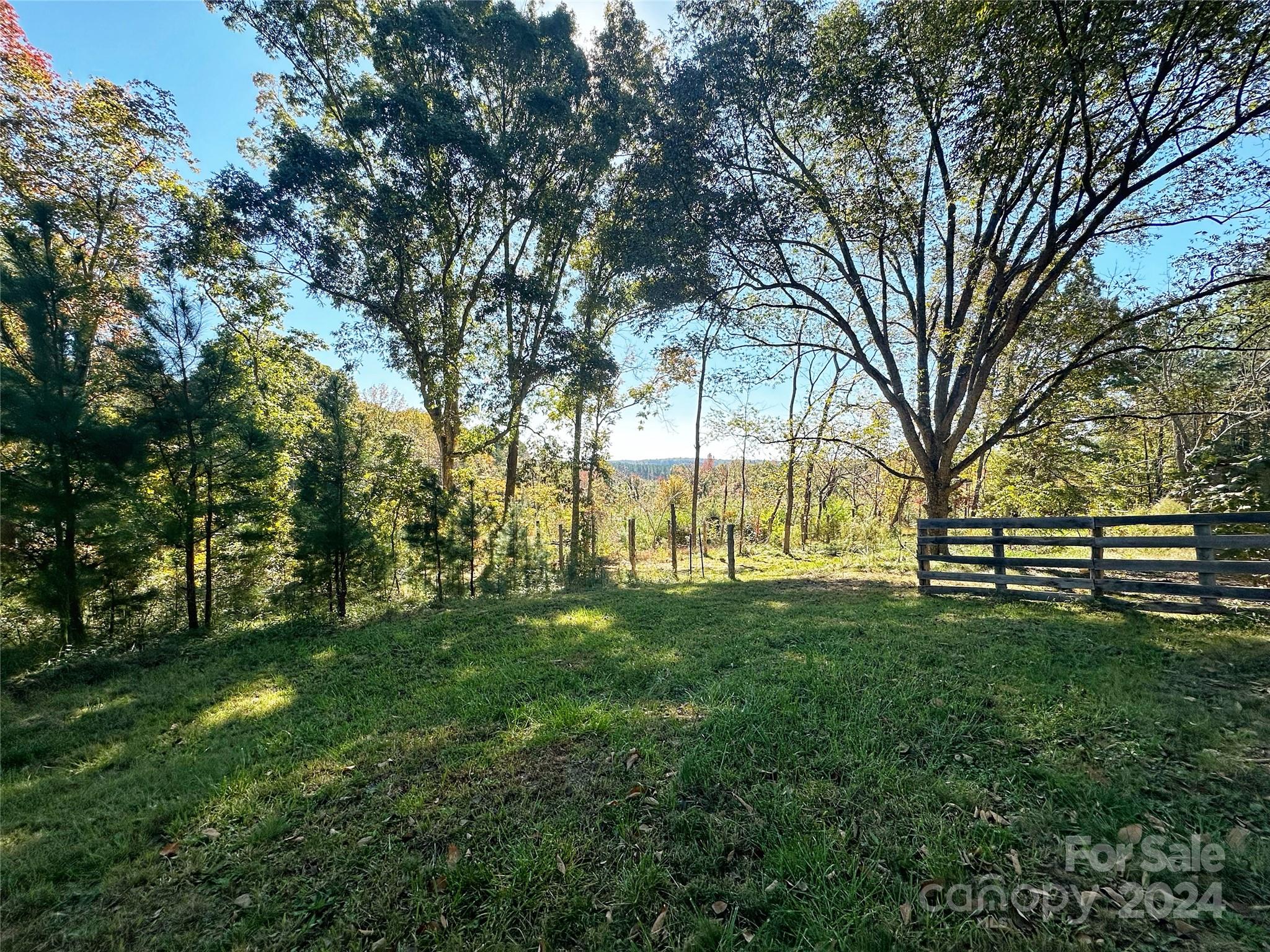 a view of grassy field with trees